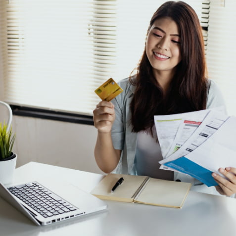 Woman holding a credit card