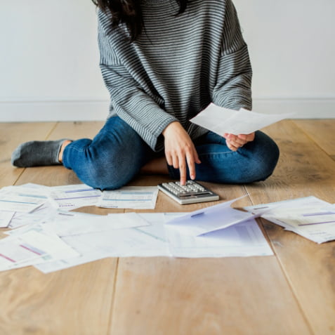 A woman using a calculator